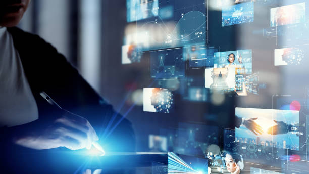 Person using a digital tablet with futuristic video editing screens and visual media overlays representing professional video editing services.