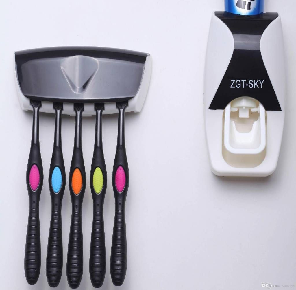 Toothpaste dispenser and toothbrush holder 