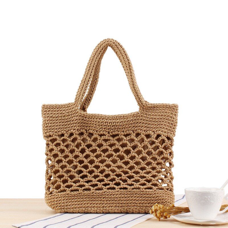 New Hollow fishing net woven bag tide female portable holiday beach straw bag Vintage travel bag