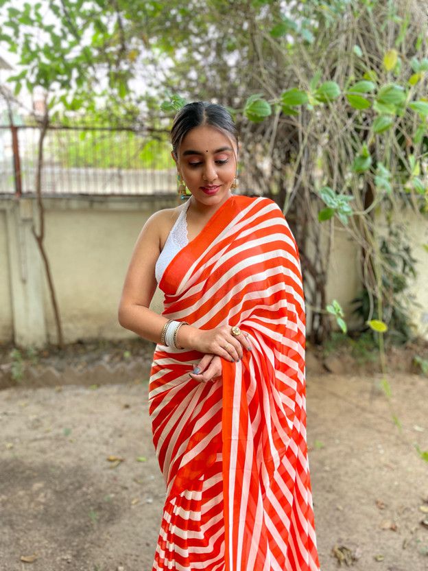 Printed, Striped Bollywood Georgette Saree  (Orange)