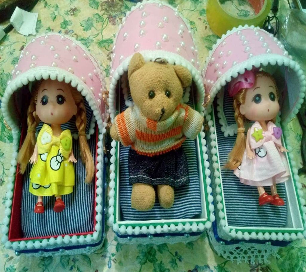 Doll lying in a bed