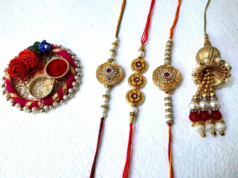 Rakhi, Thali, Chawal Roli Pack Set  (4 rakhi chawal roli)