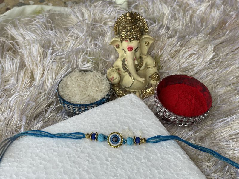 Rakhi, Chawal Roli Pack, Showpiece Set  (4 rakhi in 1 pack)