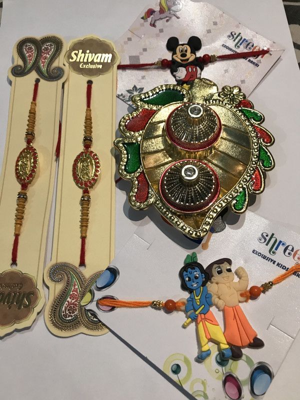 Rakhi Set  (2 BRO Rakhi, 2 Kids (Chota Bheem and Micky Mouse) Rakhi, 1 Roli Chawal Trey)