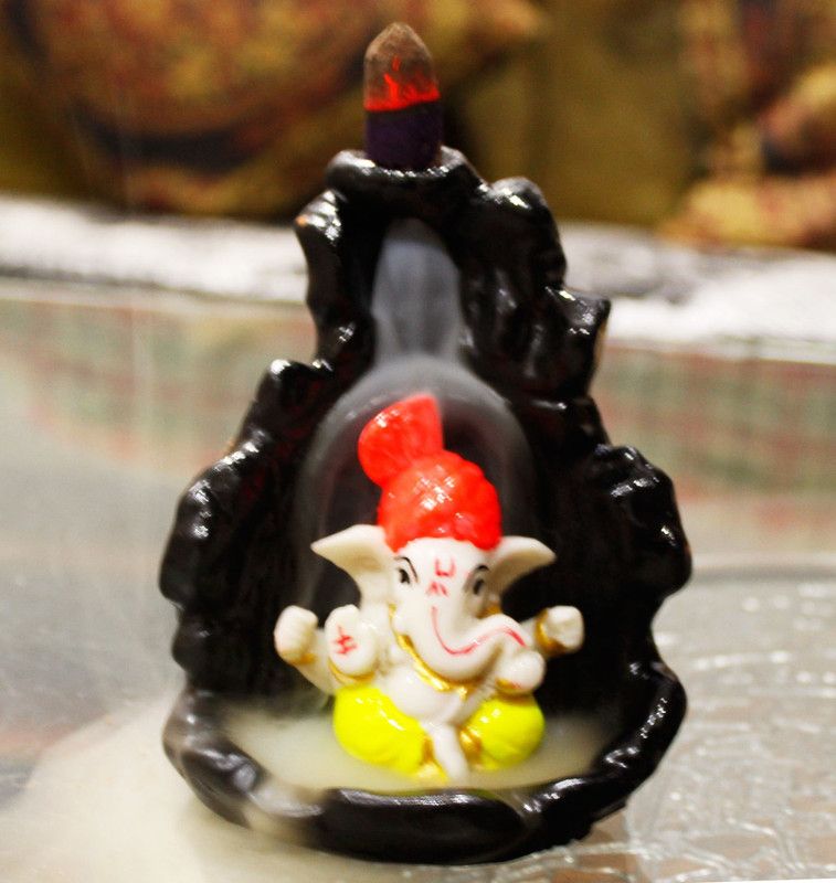 Smoke Fountain Ganesha Idol Decorative Polyresin Incense Holder  (Yellow)