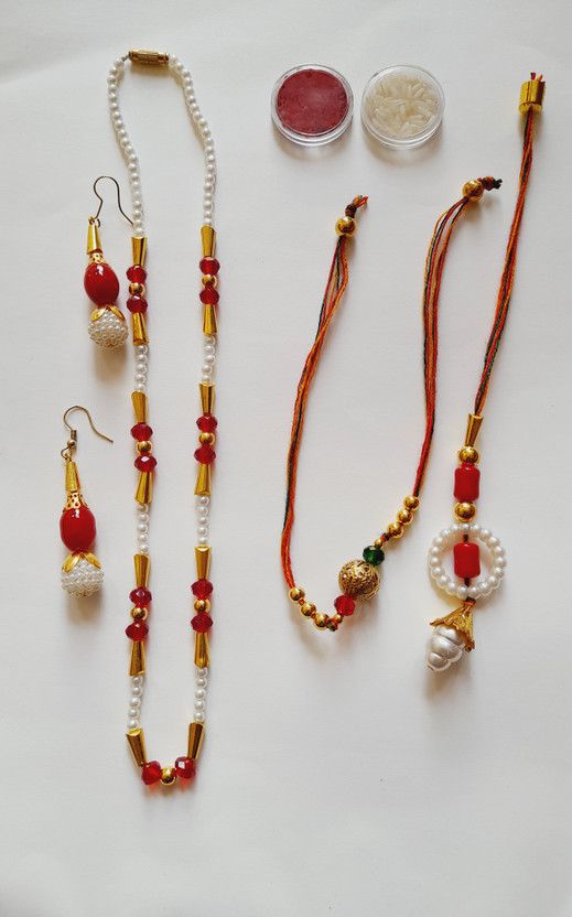 Rakhi Set  (2 rakhi, One necklace with earrings, Roli chawal)