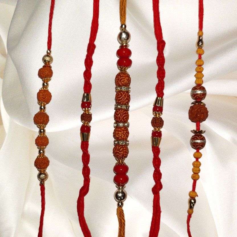 Rakhi, Chawal Roli Pack Set  (1 Rakhi for Bhaiya, 1 Rakhi for Bhabhi, 3 Fancy Rakhi, Roli Chawal Included in Package)