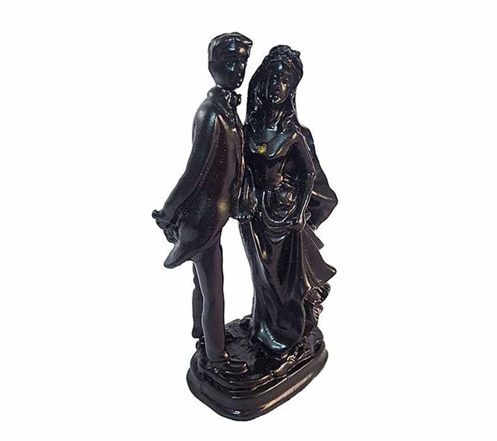 Newly Married Couple Posing Black Showpiece with Colored Stone