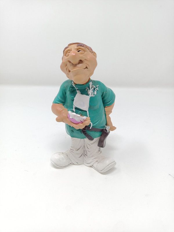 glitterthings Beautifully Hand Crafted Decorative Figurine of Dentist for Home Decor & Gifting Decorative Showpiece - 13.5 cm  (Polyresin, Multicolor)