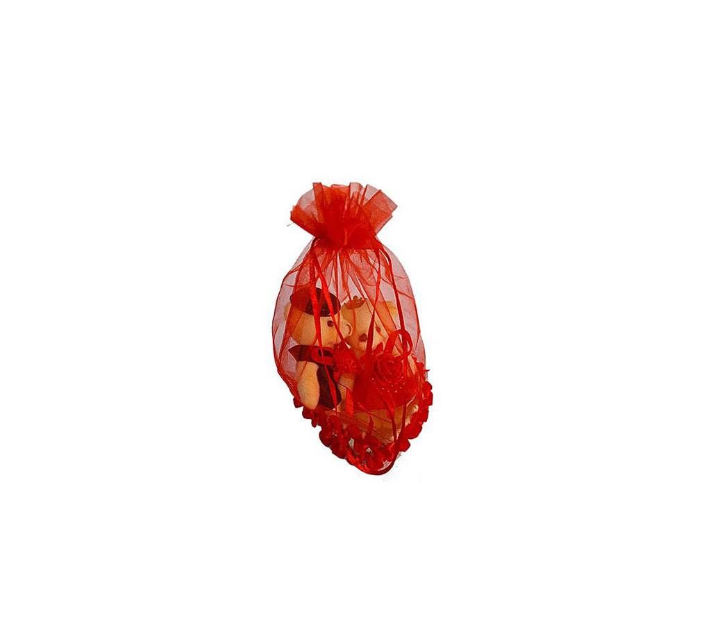 Cute teddy bear couple in a basket - red