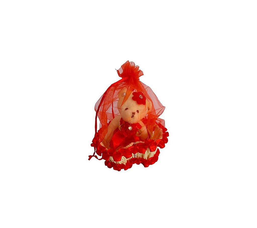 Cute teddy bear in a basket - red