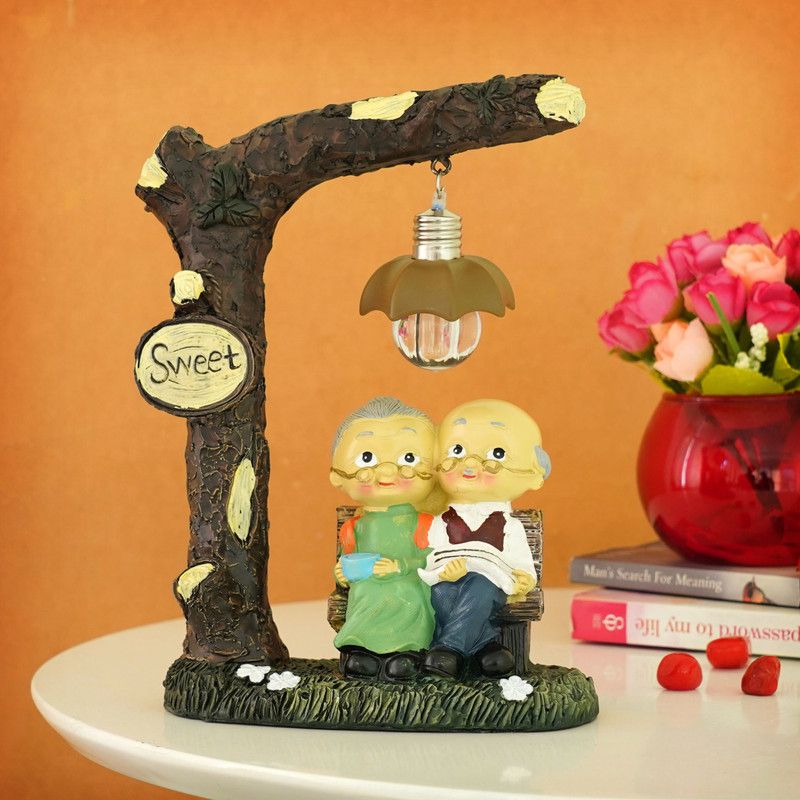TIED RIBBONS Old Age Cute Romantic Couple Grand Parrents/ Dada Dadi Showpiece for Husband Wife Birthday Anniversary Valentine Day Gift Item Decorative Showpiece - 20.3 cm  (Polyresin, Multicolor)
