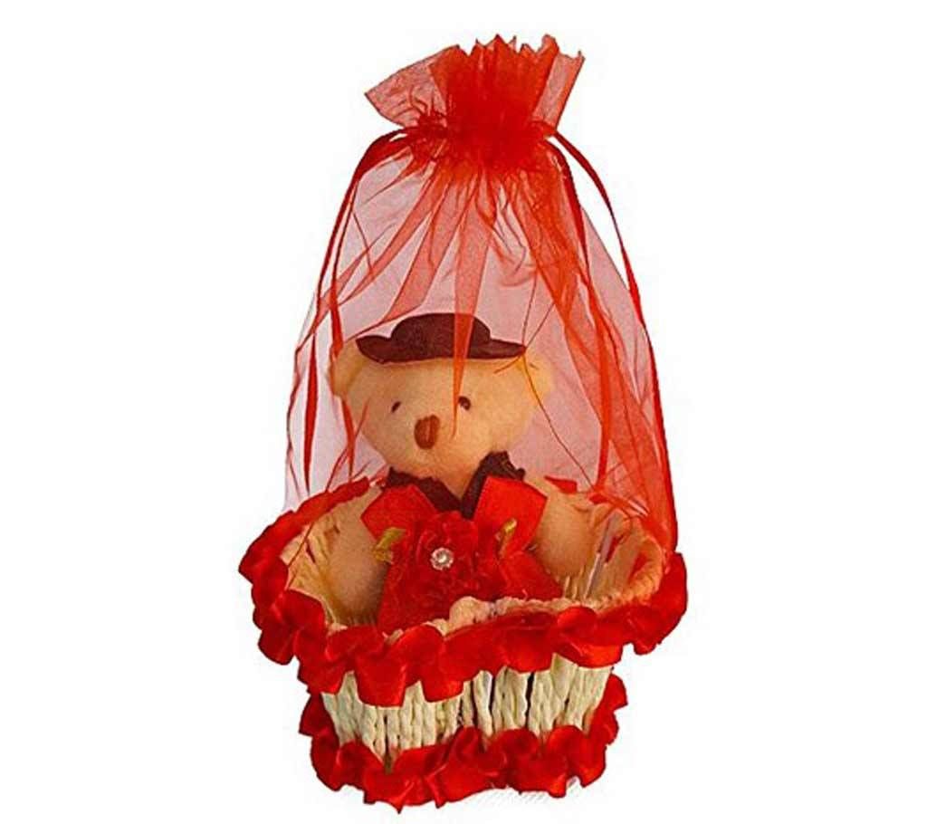 Teddy bear with hat in a basket - red
