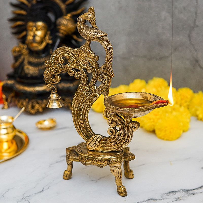 StatueStudio Brass Diya Peacock Diya with Bell Pooja Oil Lamp Diya Home Decor Light Lamp Brass Table Diya  (Height: 12 inch)