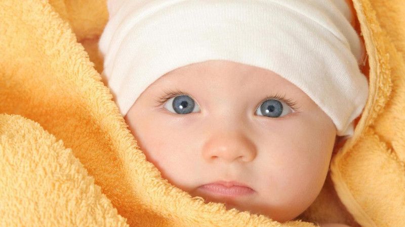 Cute baby under yellow towel Poster Paper Print  (18 inch X 24 inch, Rolled)