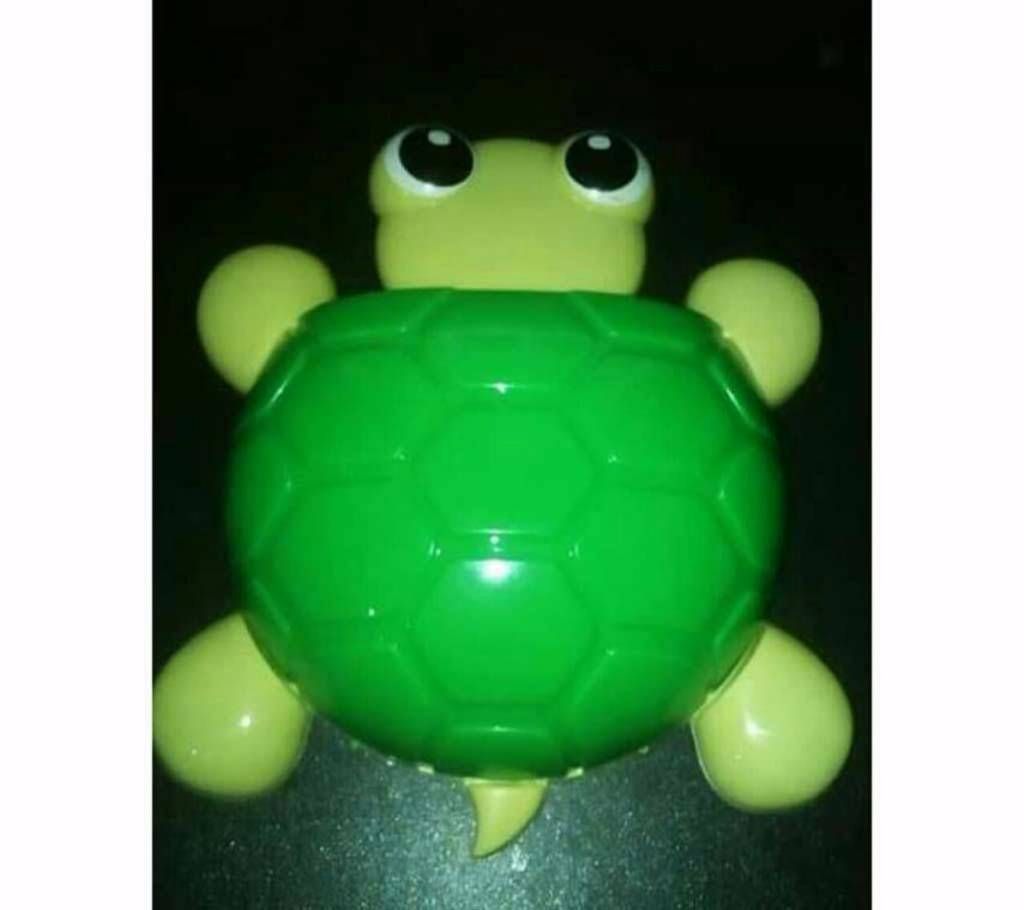 Turtle shaped toothbrush holder