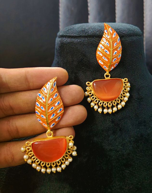 Traditional Brass earrings in Matte finish and have Handpainted work on leaf with crystal stone embedded with pearl work Brass Jhumki Earring
