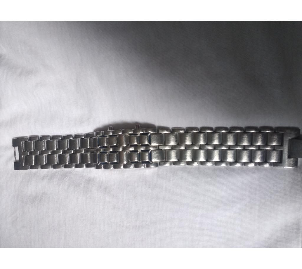 It's a metal chain clock.