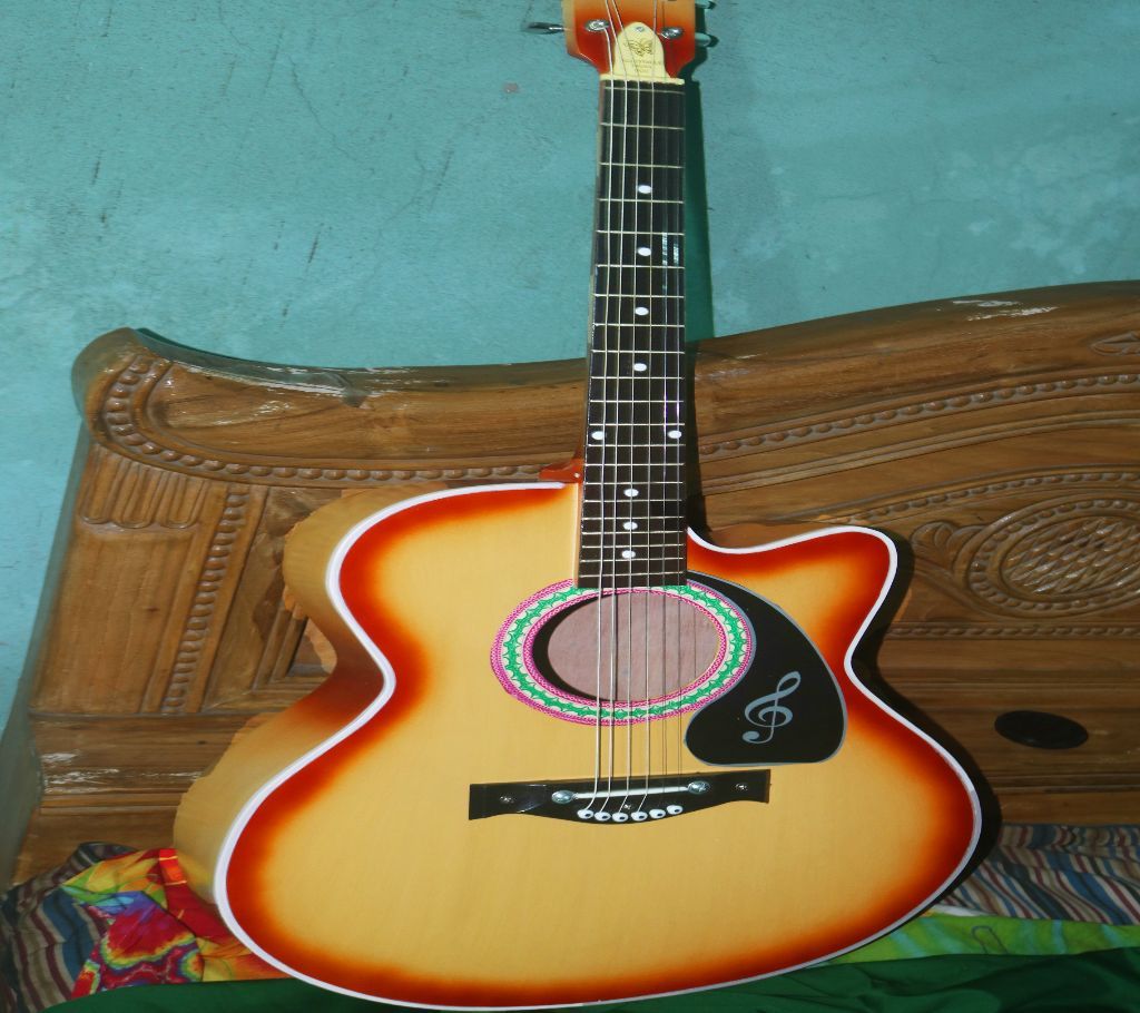 Best quality acoustic guitar with bag and pick (golder color)