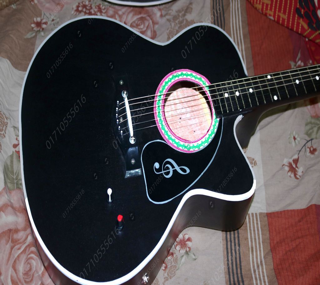 Acoustic guitar with tone and volume controller system