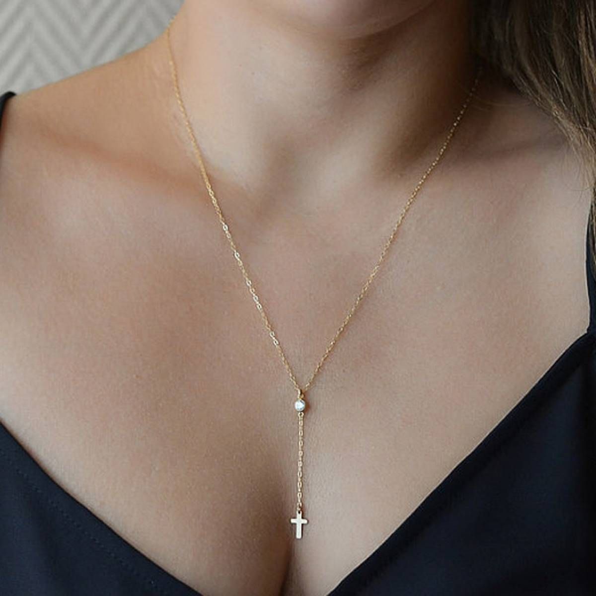 The new fashion accessories are studded with artificial stone cross pendant and elegant lady necklace