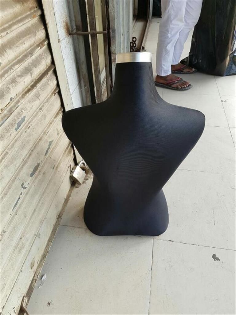 black stand doll