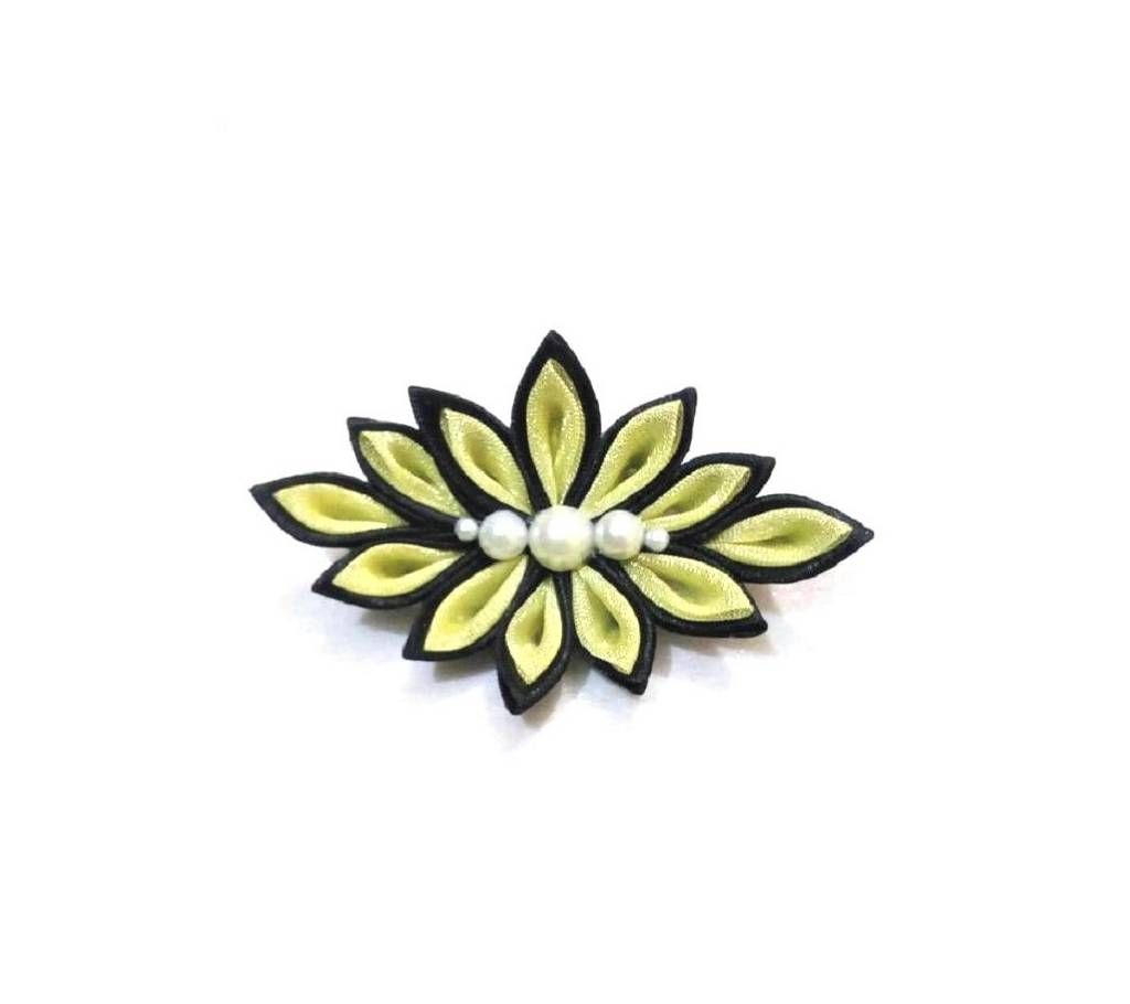 Black floral brooch