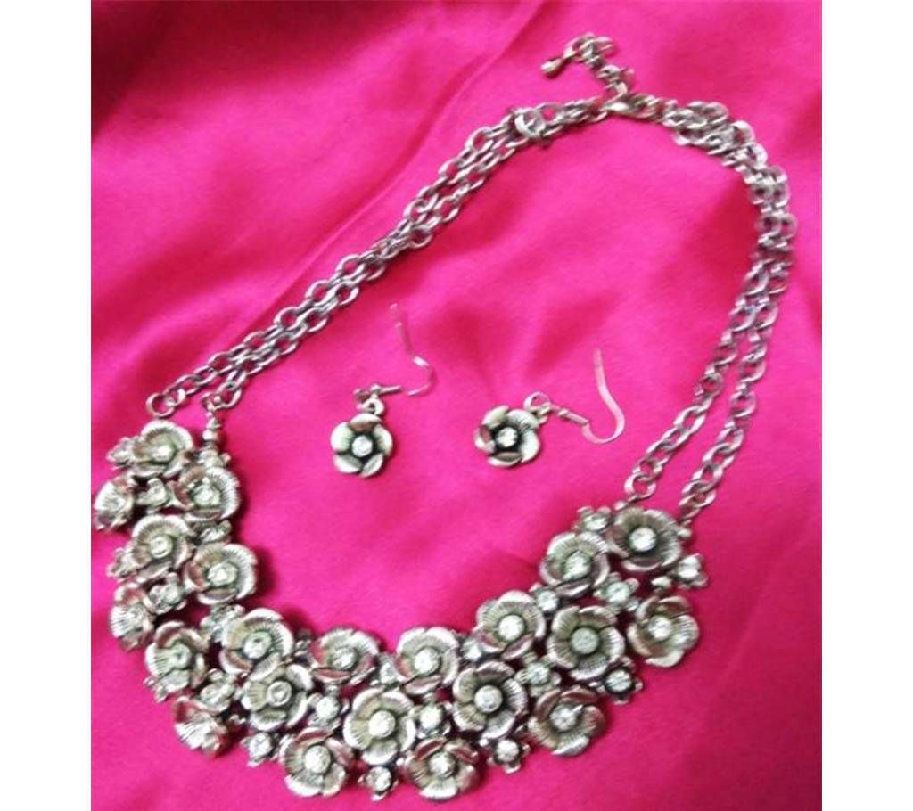 Silver colored necklaces with earring